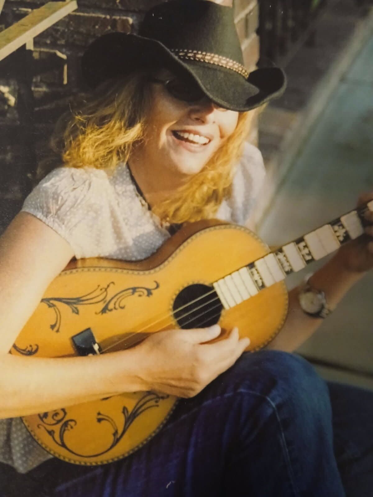 Sandy Hutchinson playing guitar